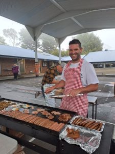 Parent cooking at BBQ during Election Day