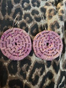 Circular earrings woven out of raffia